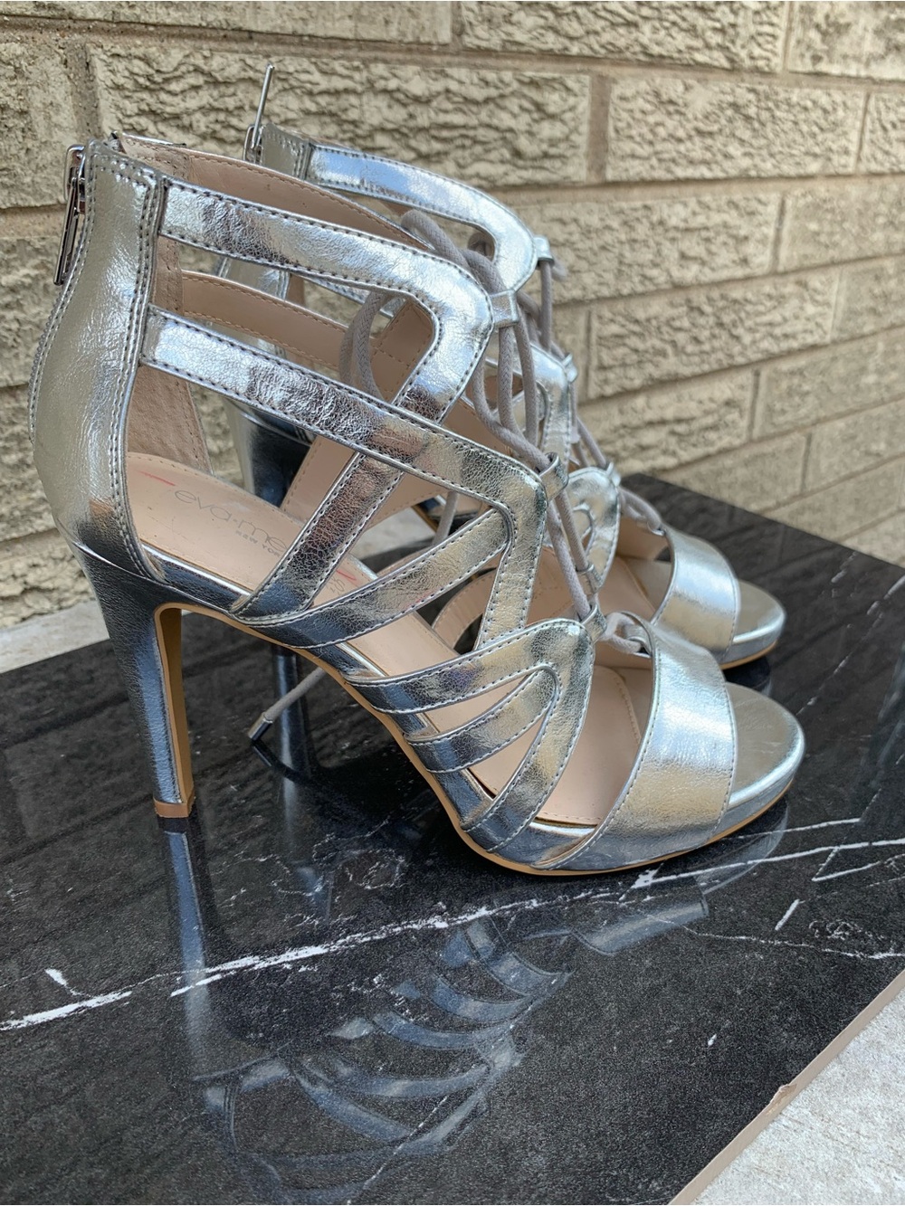 Eva Mendes silver gladiator sandals size 7